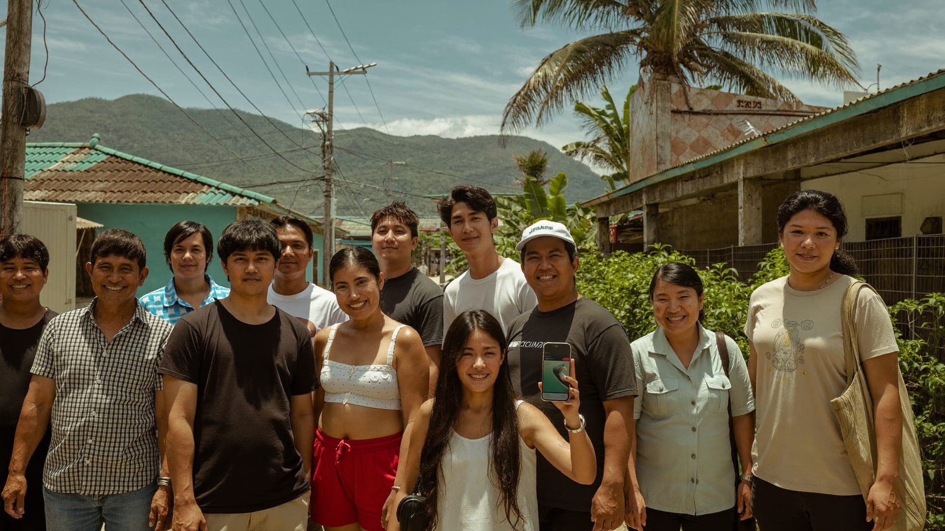 Smiling PANELCO III member-consumers on a sunny street in eastern Pangasinan under the power lines